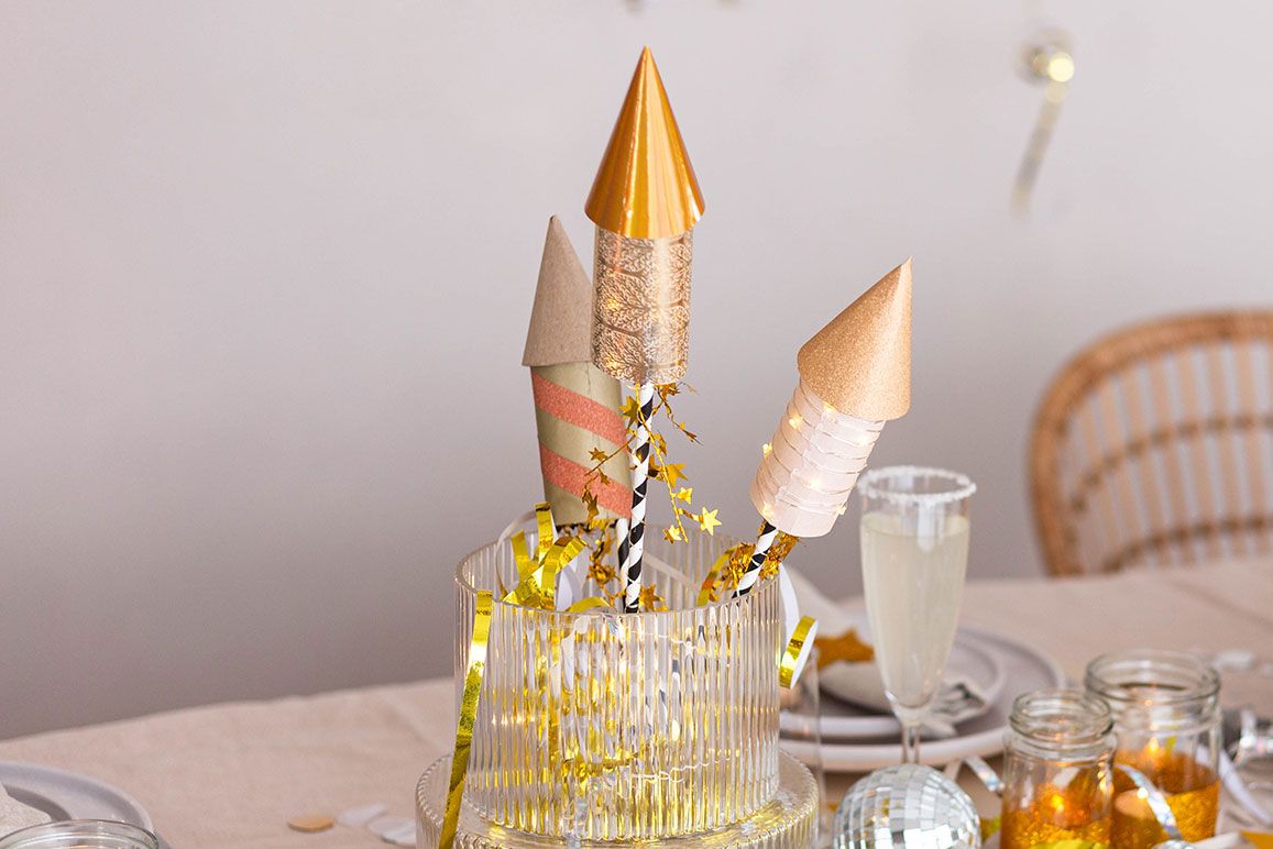Silvester Deko basteln: leuchtende Raketen für deinen Tisch